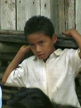 Boy near village market.