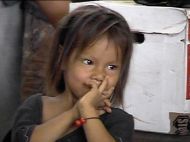 Girl in schoolhouse.