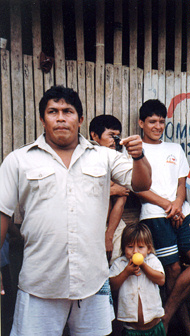 Ucille holds up a rhinoscerous beetle. Note the little girl with the balloon.