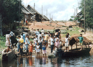 Villagers gather to greet us at the water's edge.